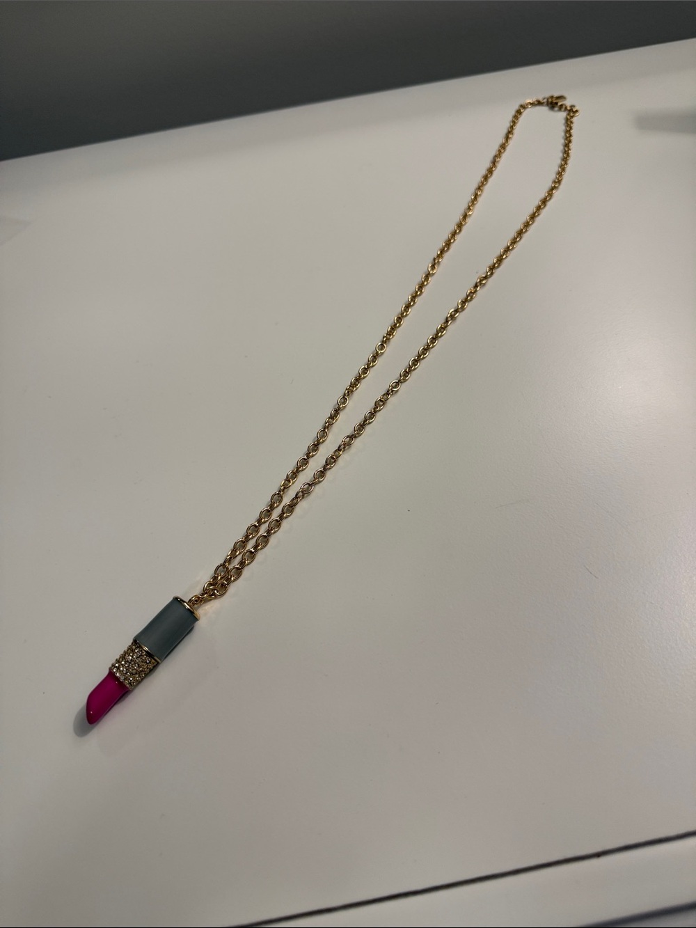 kate spade Gold Tone Necklace with Pink and Gray Lipstick Charm